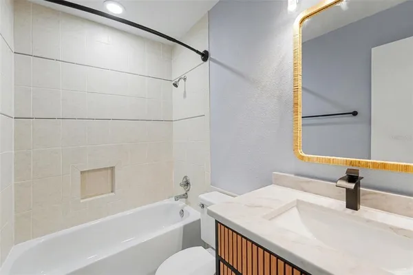 a bathroom with a sink and a bathtub