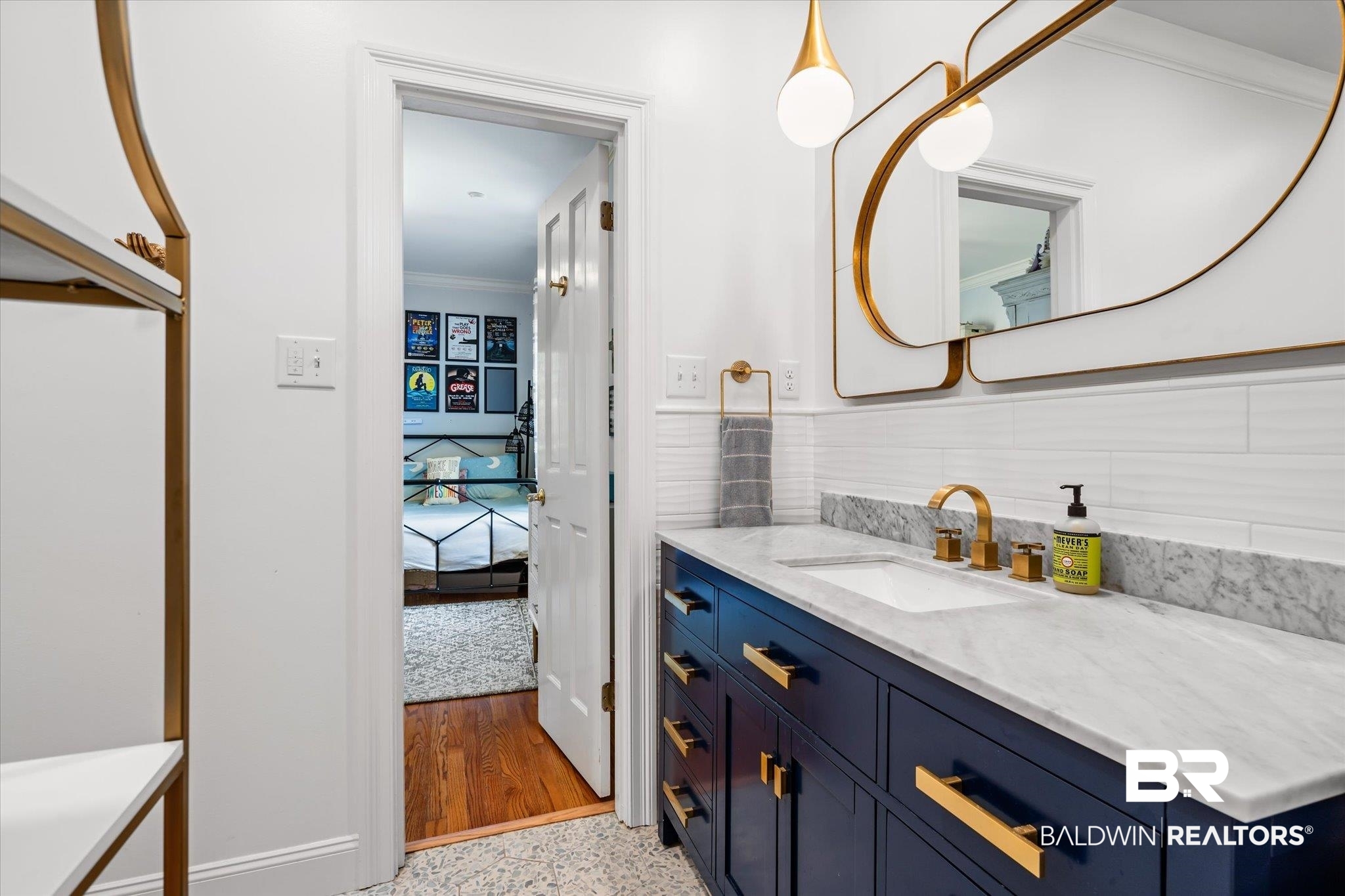 4 Kingsway Mobile, AL 36608 - Photo 24 of 44 Bathroom featuring speckled floor, vanity, and crown molding
