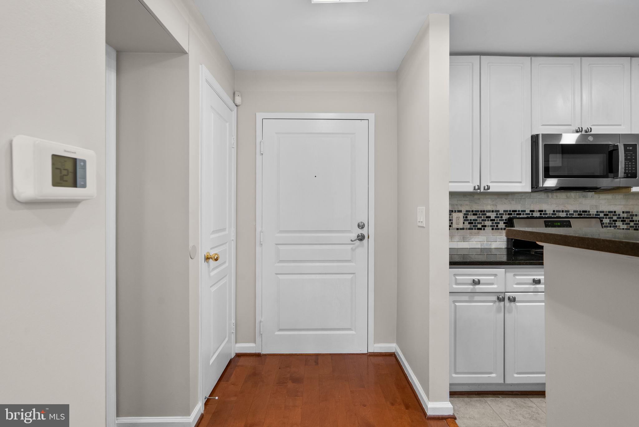 5563 Seminary Road, Unit 302 Falls Church, VA 22041 - Photo 11 of 30 a kitchen with white cabinets and stainless steel appliances