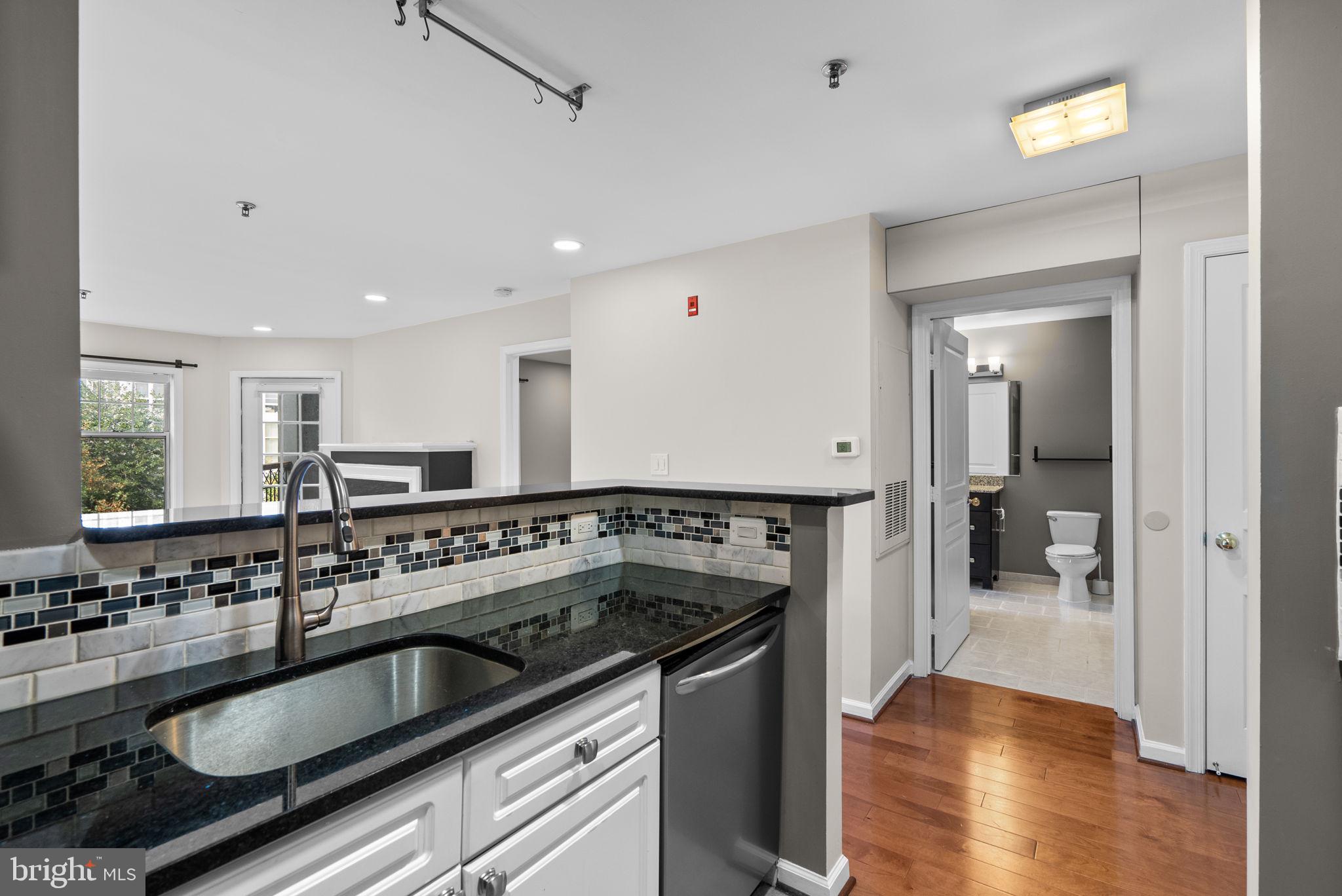 5563 Seminary Road, Unit 302 Falls Church, VA 22041 - Photo 15 of 30 a kitchen with a sink stove and cabinets