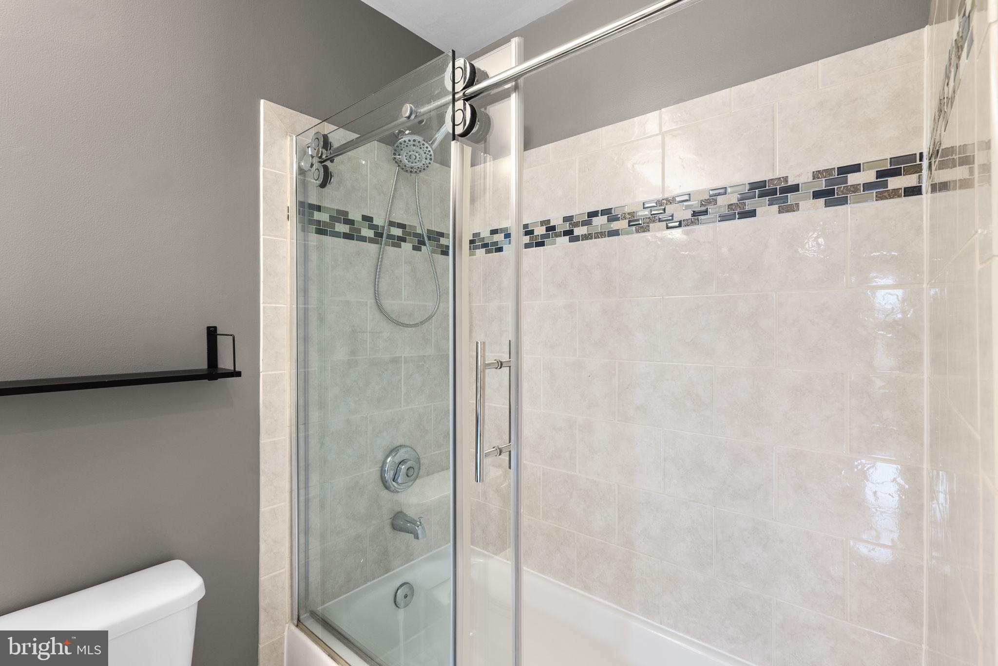 5563 Seminary Road, Unit 302 Falls Church, VA 22041 - Photo 24 of 30 a bathroom with a shower and a toilet