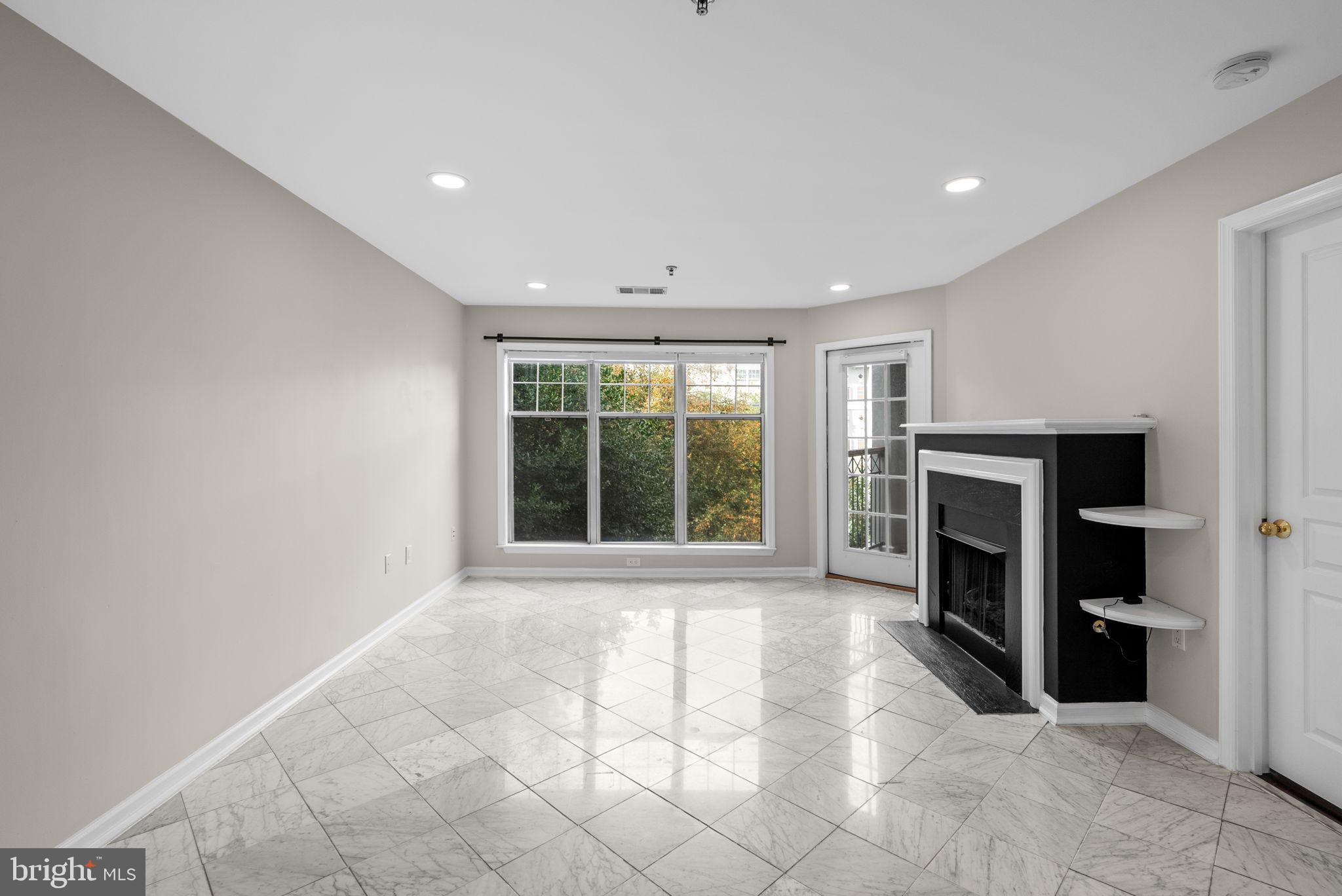 5563 Seminary Road, Unit 302 Falls Church, VA 22041 - Photo 6 of 30 a view of an empty room with a window and kitchen view