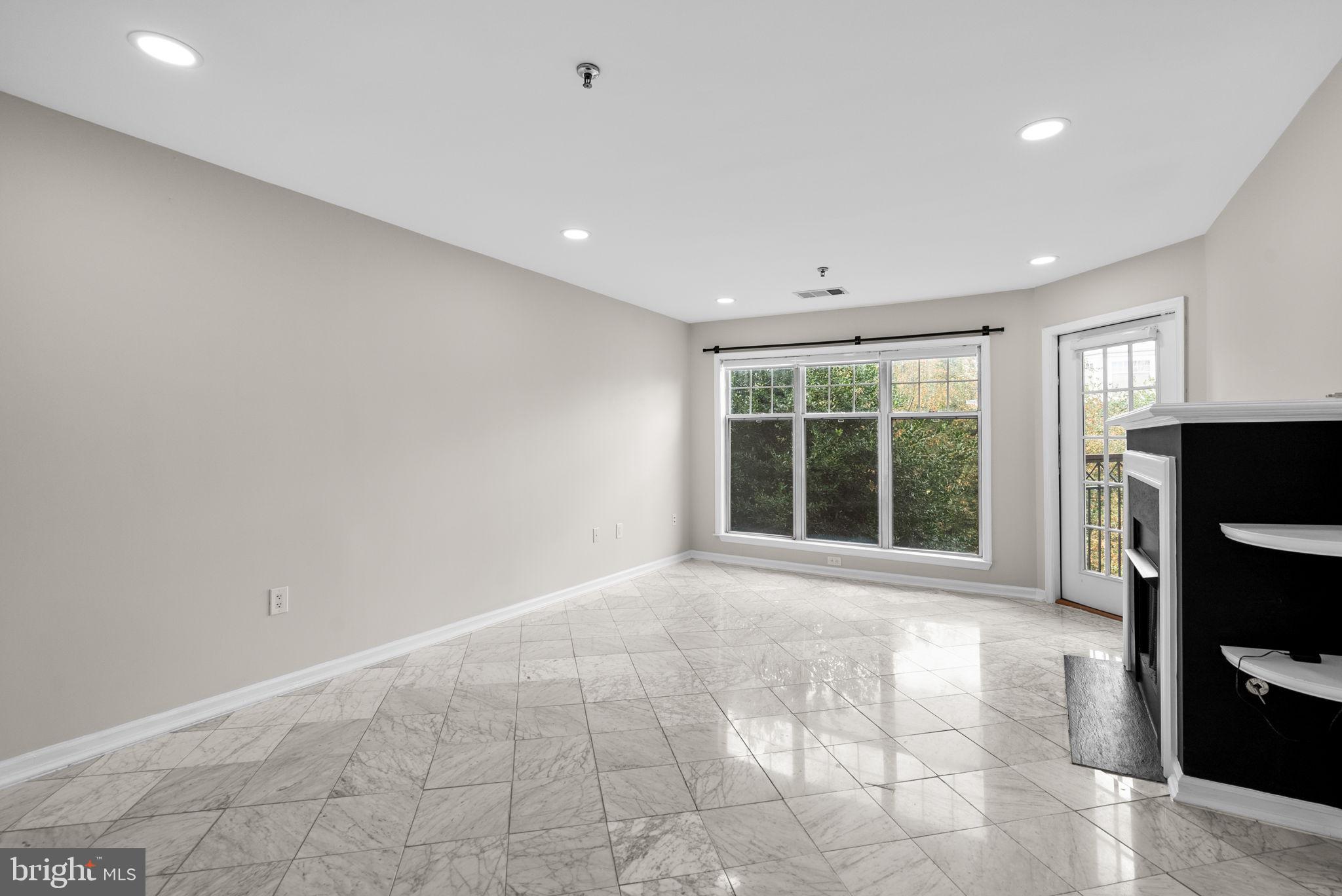 5563 Seminary Road, Unit 302 Falls Church, VA 22041 - Photo 7 of 30 a view of an empty room with a window and a kitchen