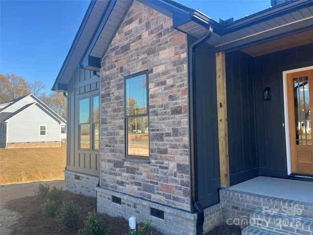 a view of front door of house with stairs