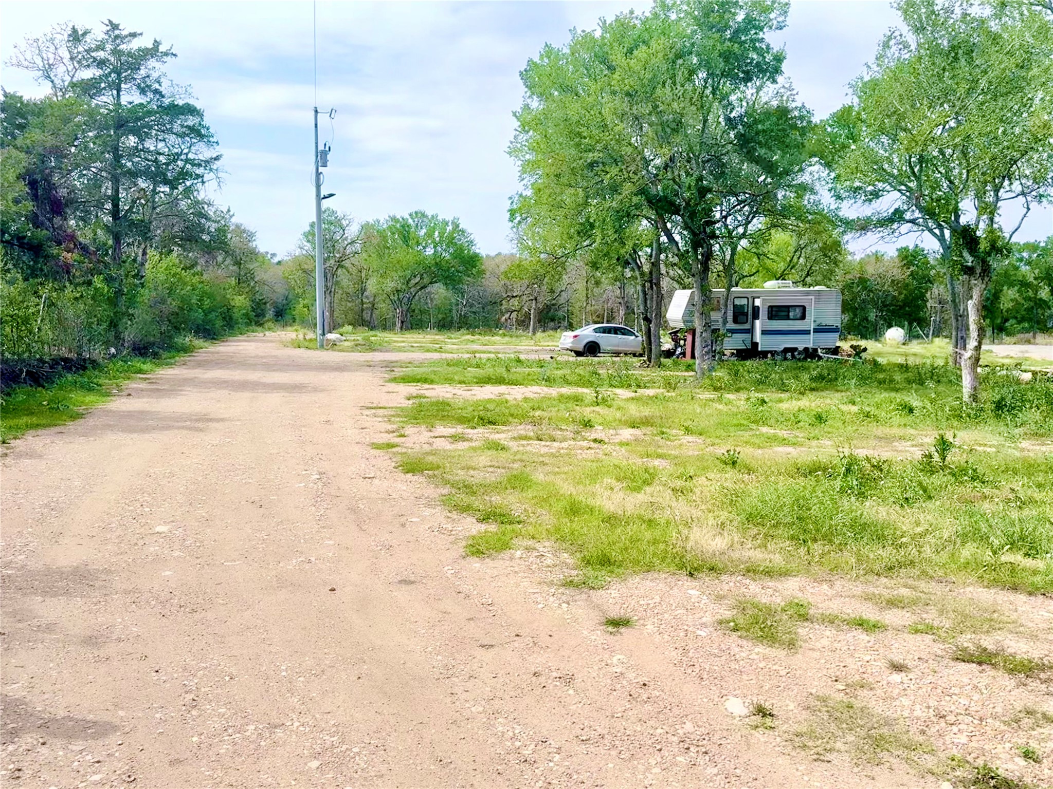 9024 Lockwood Springs Road Manor, TX 78653 - Photo 5 of 25 a swimming pool with yard barbeque oven and outdoor seating