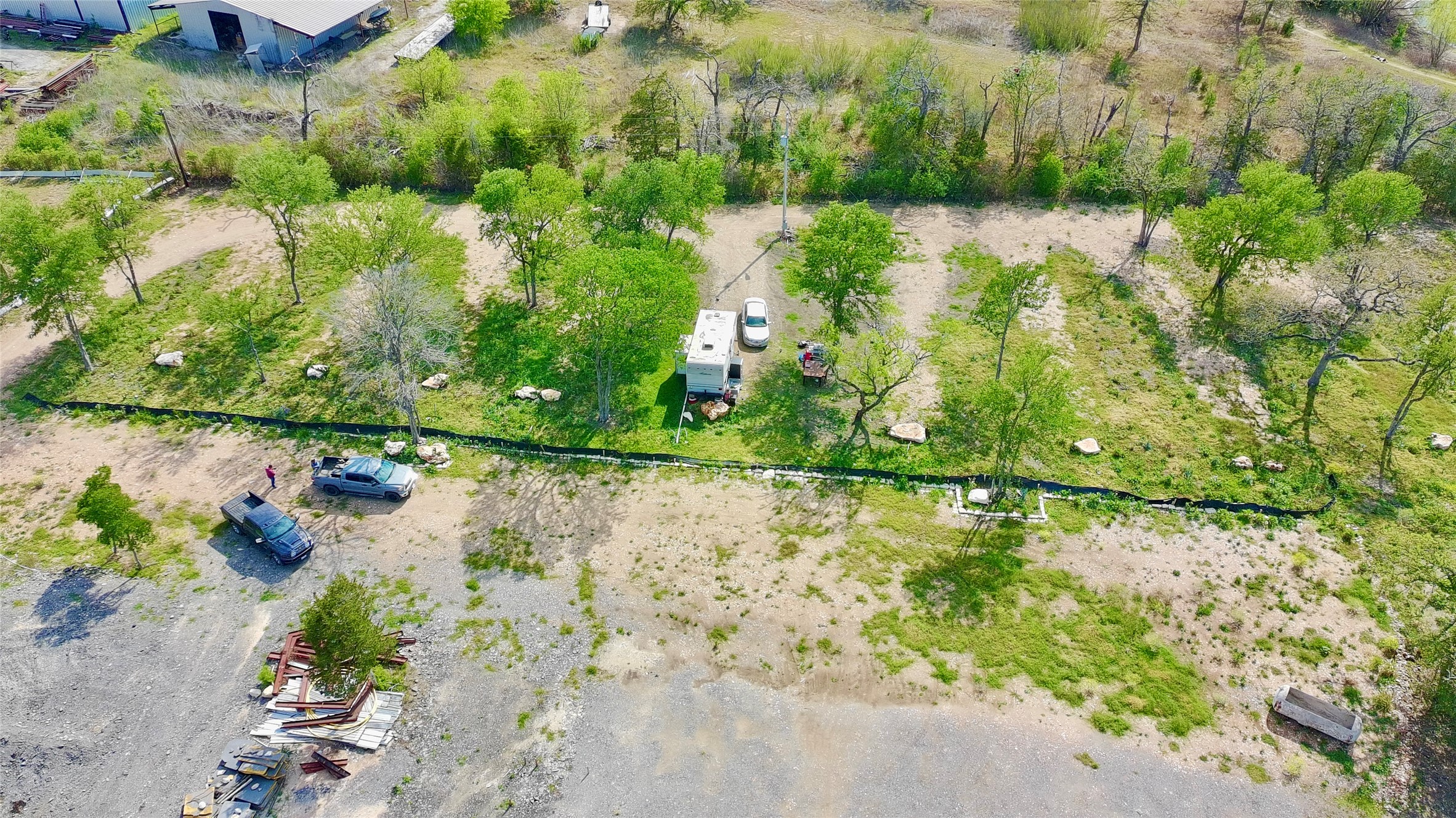 9024 Lockwood Springs Road Manor, TX 78653 - Photo 8 of 25 a view of a lake with large trees