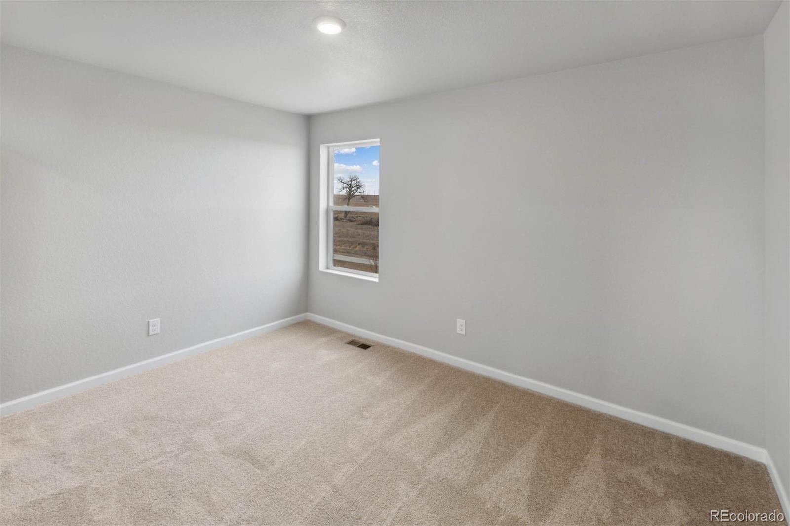 2125 Alyssa Street Fort Lupton, CO 80621 - Photo 15 of 39 an empty room with windows