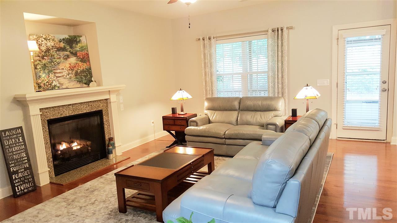 138 Tramway Circle Angier, NC 27501 - Photo 2 of 26 a living room with furniture and a fireplace