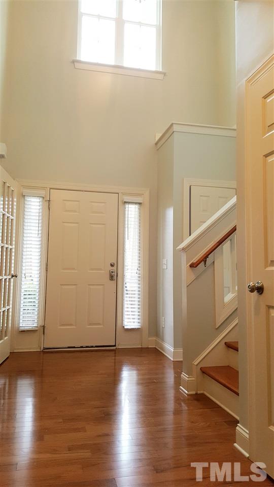 138 Tramway Circle Angier, NC 27501 - Photo 13 of 26 an empty room with wooden floor and windows