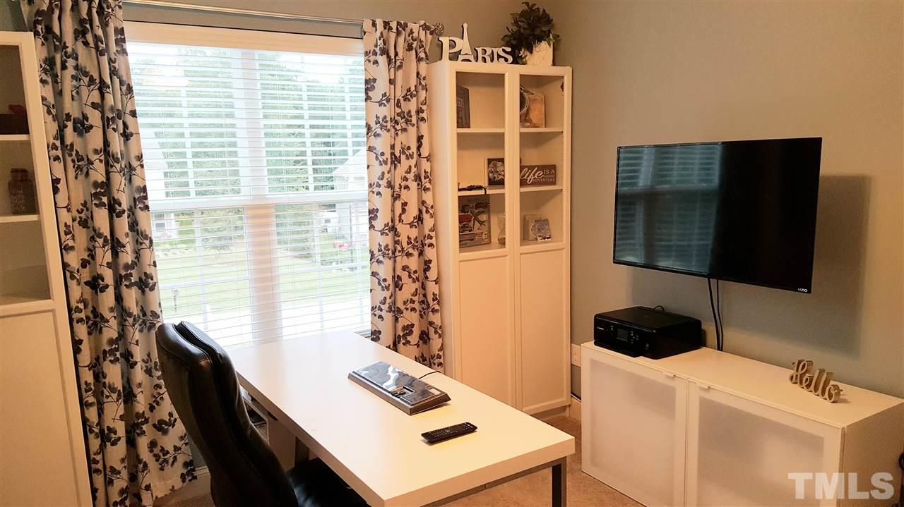 138 Tramway Circle Angier, NC 27501 - Photo 16 of 26 a view of a workspace with furniture and a window