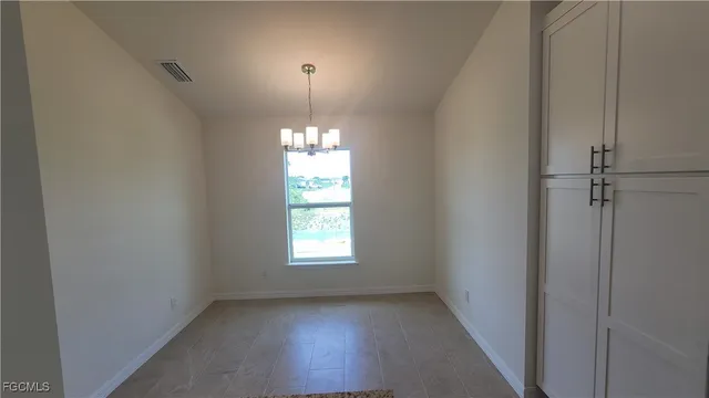 a kitchen with kitchen island a sink stainless steel appliances and cabinets