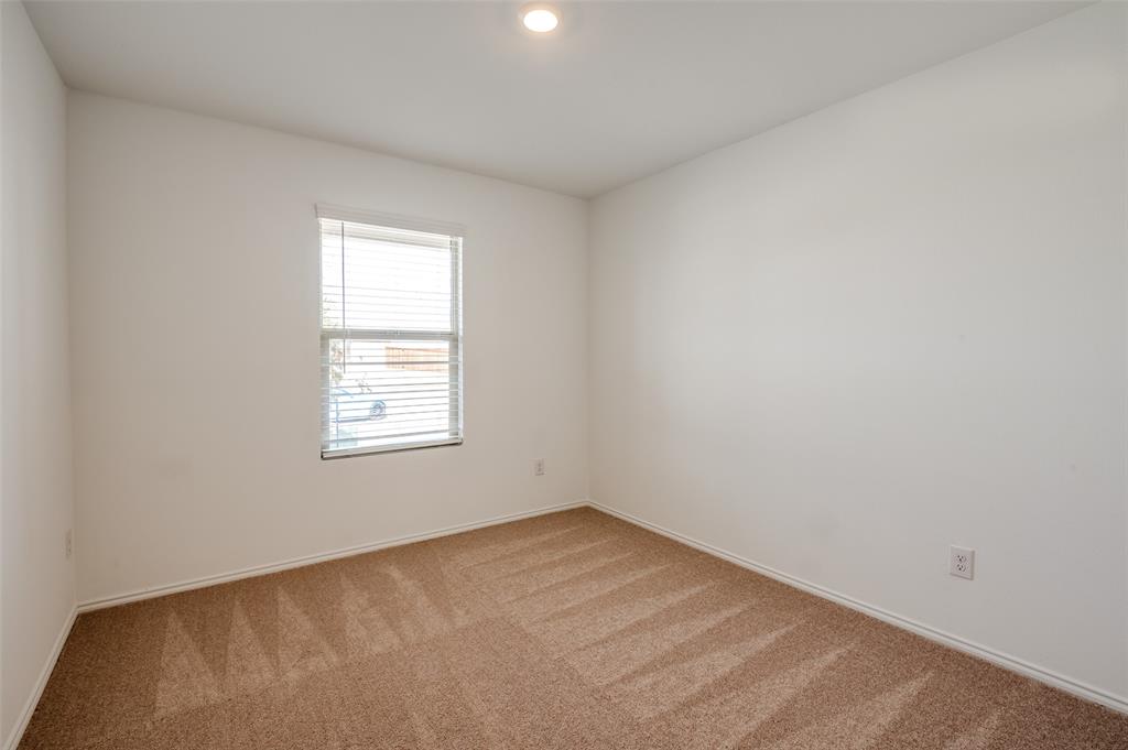 2813 Watchpoint Road Little Elm, TX 75068 - Photo 5 of 8 Spare room featuring baseboards and light carpet