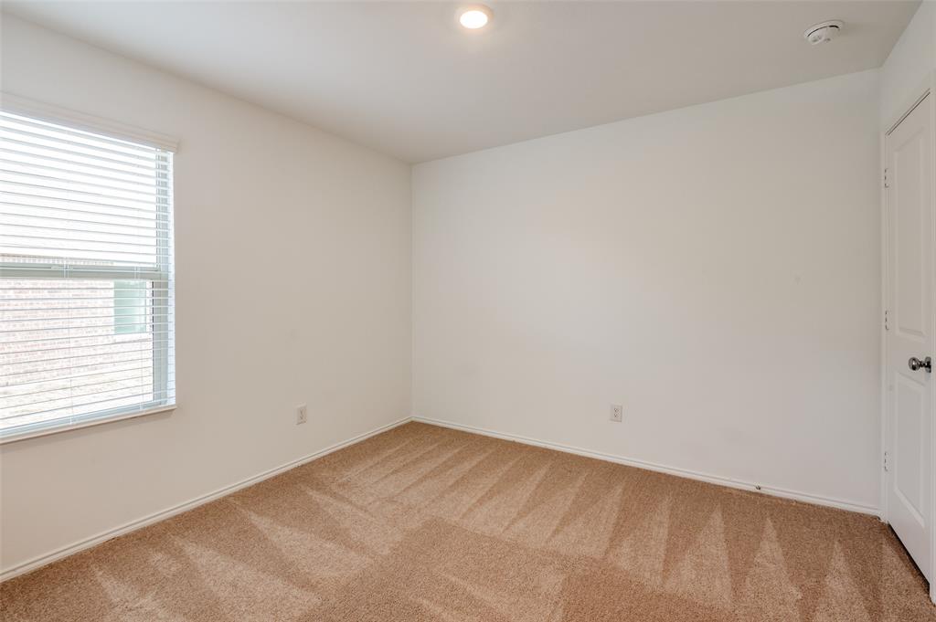 2813 Watchpoint Road Little Elm, TX 75068 - Photo 6 of 8 Unfurnished room featuring carpet and baseboards