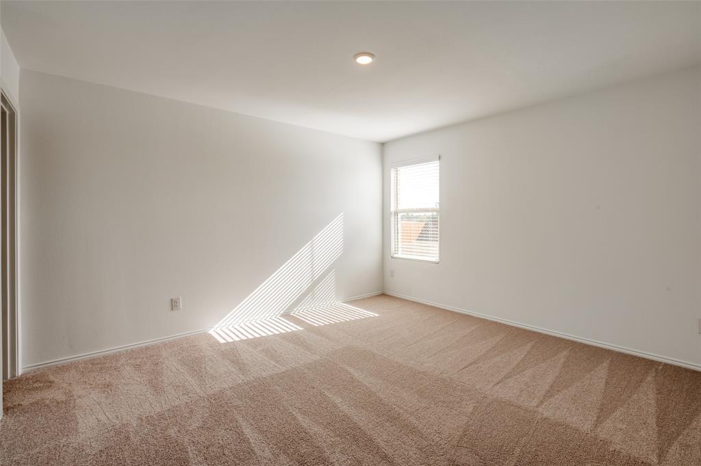 2813 Watchpoint Road Little Elm, TX 75068 - Photo 7 of 8 Carpeted spare room with baseboards and recessed lighting