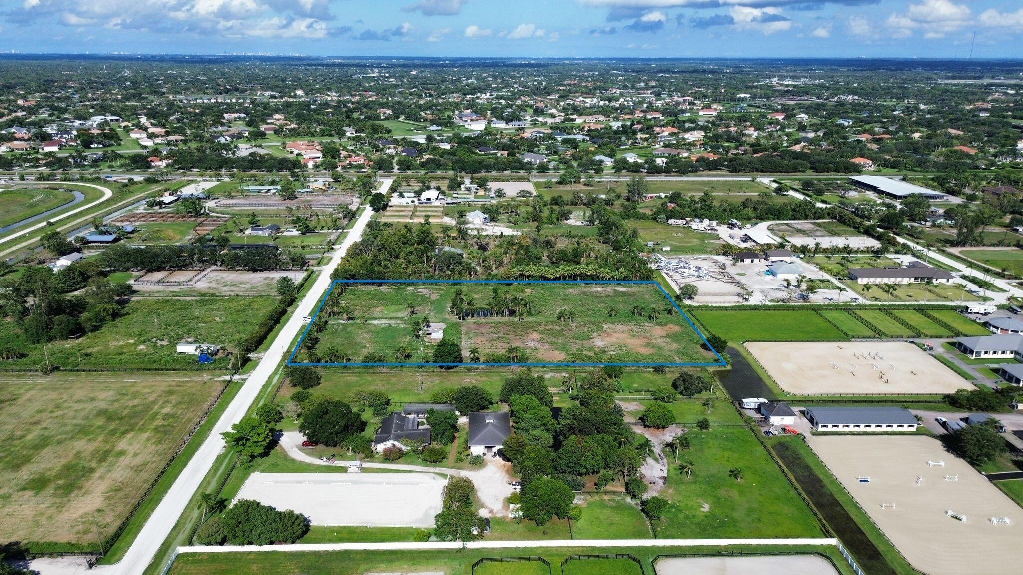 16290 Rustic Road Wellington, FL 33470 - Photo 8 of 20 an aerial view of residential houses with outdoor space and swimming pool