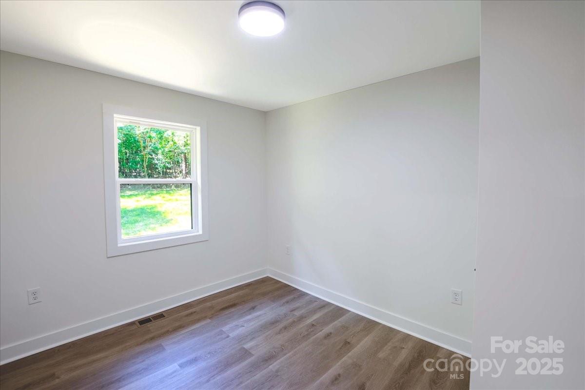 2918 Lon Street Shelby, NC 28152 - Photo 16 of 17 an empty room with wooden floor and windows