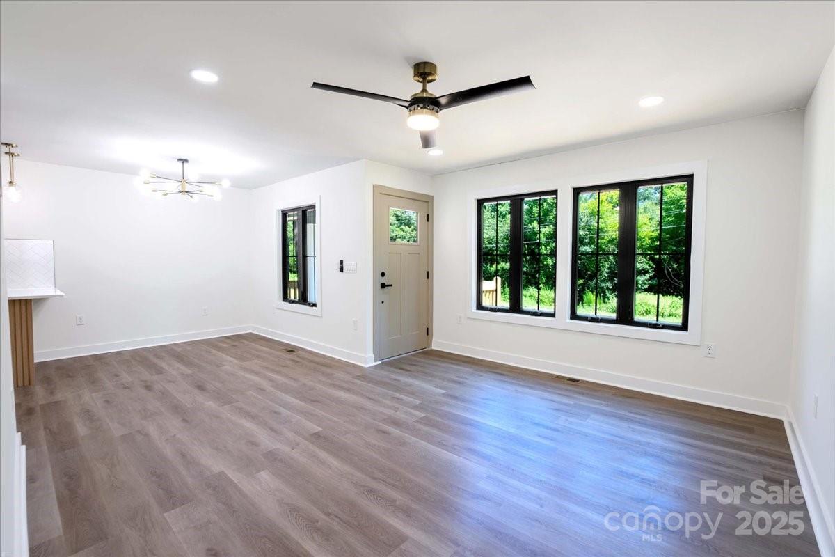2918 Lon Street Shelby, NC 28152 - Photo 6 of 17 a view of an empty room with a window and wooden floor