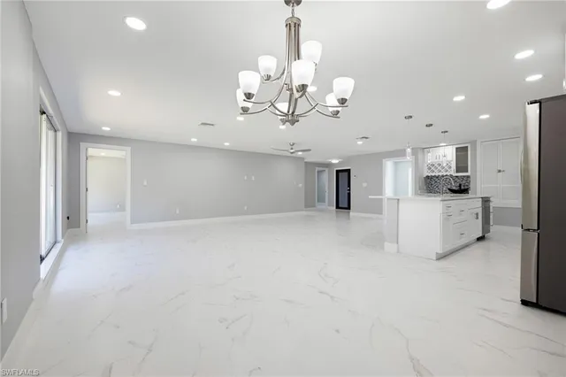a view of a kitchen with a sink and cabinets