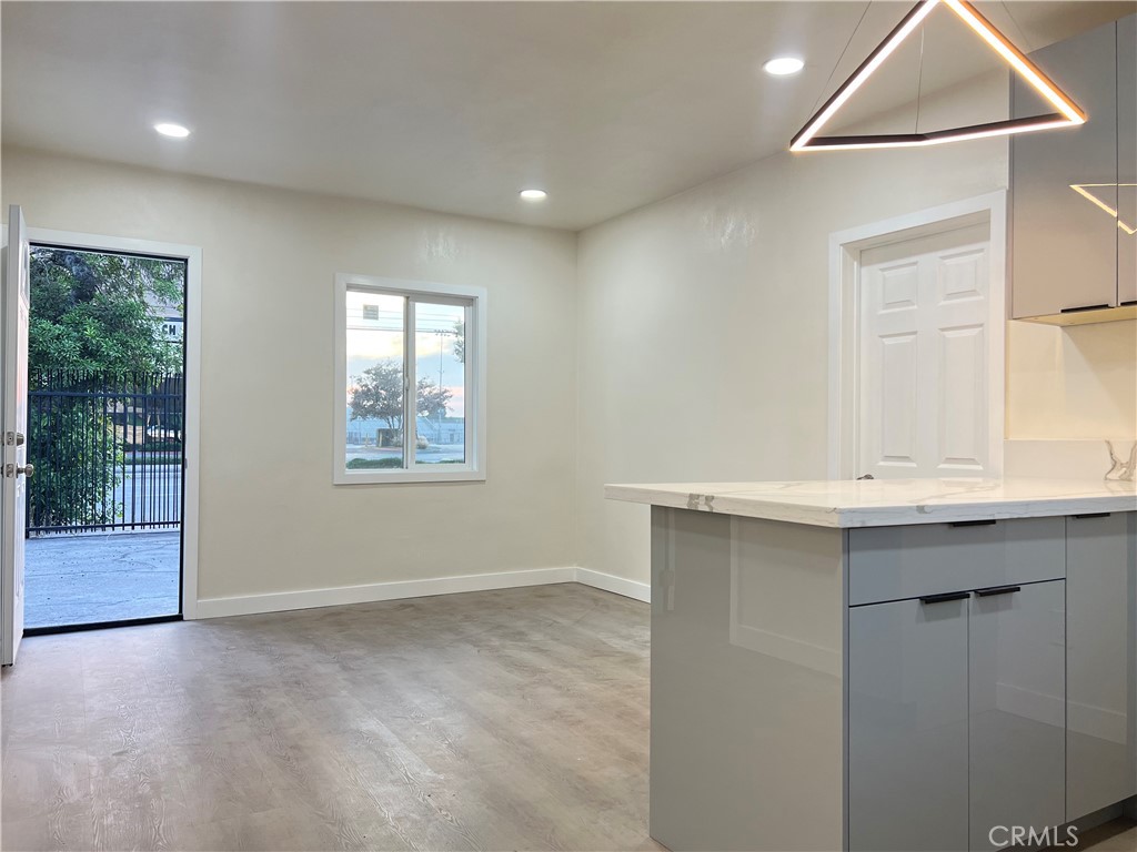 3114 Peck Road El Monte, CA 91732 - Photo 7 of 10 an empty room with windows and cabinet