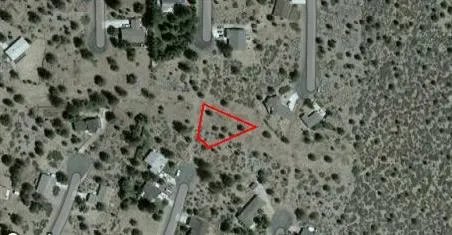 a view of a yard covered in snow