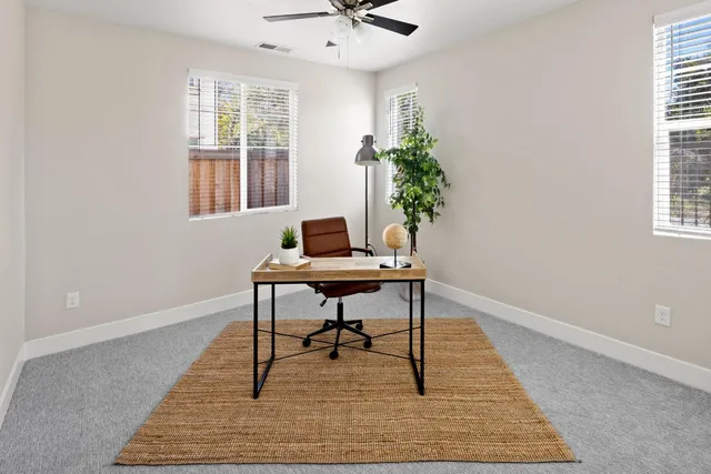 a workspace with furniture and a window