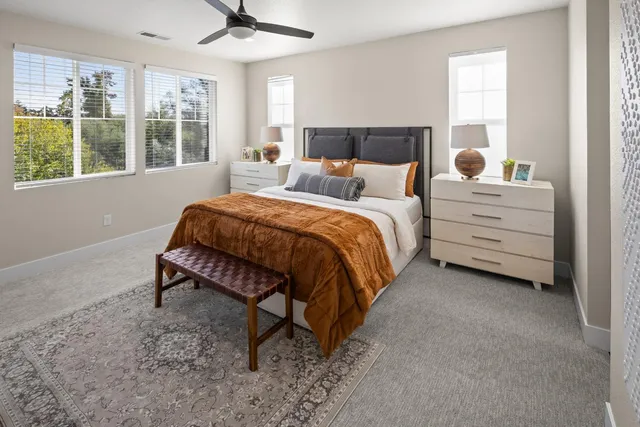 a bed room with a bed and a window