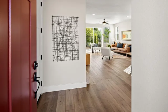 wooden floor in an empty room and a window
