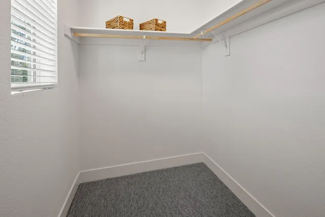 a view of a small space with racks on the wall