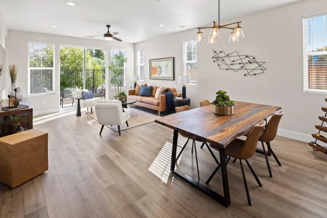 a view of a dining room with furniture window and outside view