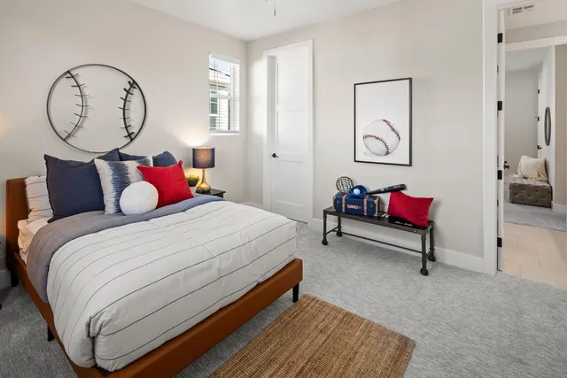 a bedroom with bed and a closet