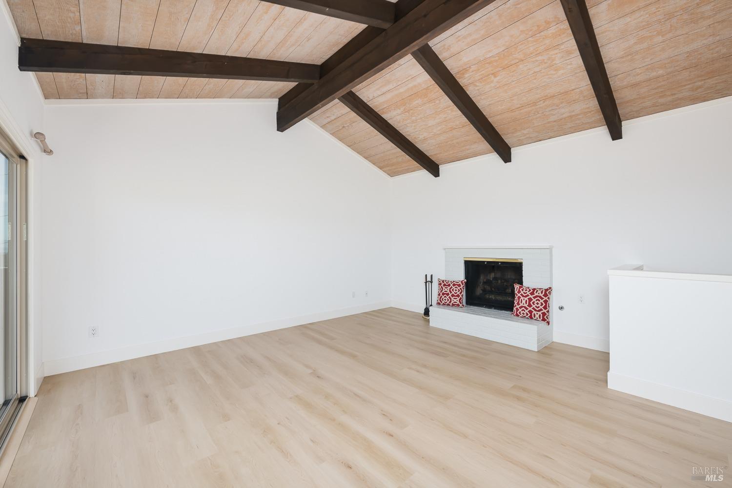 124 Tiburon Boulevard San Rafael, CA 94901 - Photo 11 of 39 Living room with fireplace and vaulted ceiling