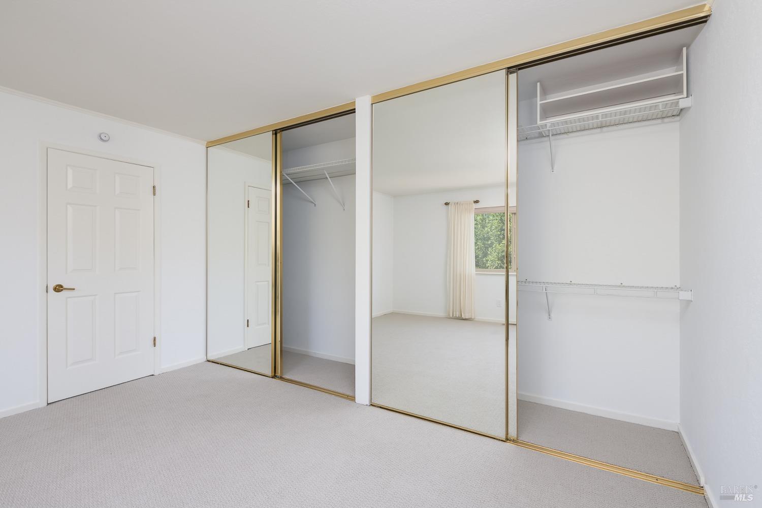 124 Tiburon Boulevard San Rafael, CA 94901 - Photo 23 of 39 Primary bedroom wall of closets
