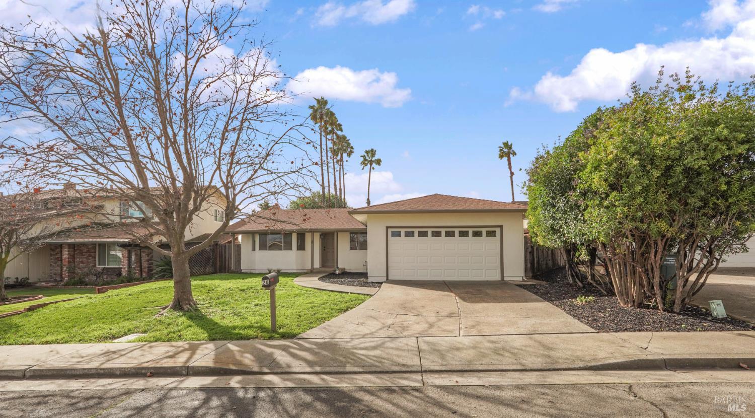 28 Amador Circle Rio Vista, CA 94571 - Photo 13 of 39 a front view of a house with a garden and trees