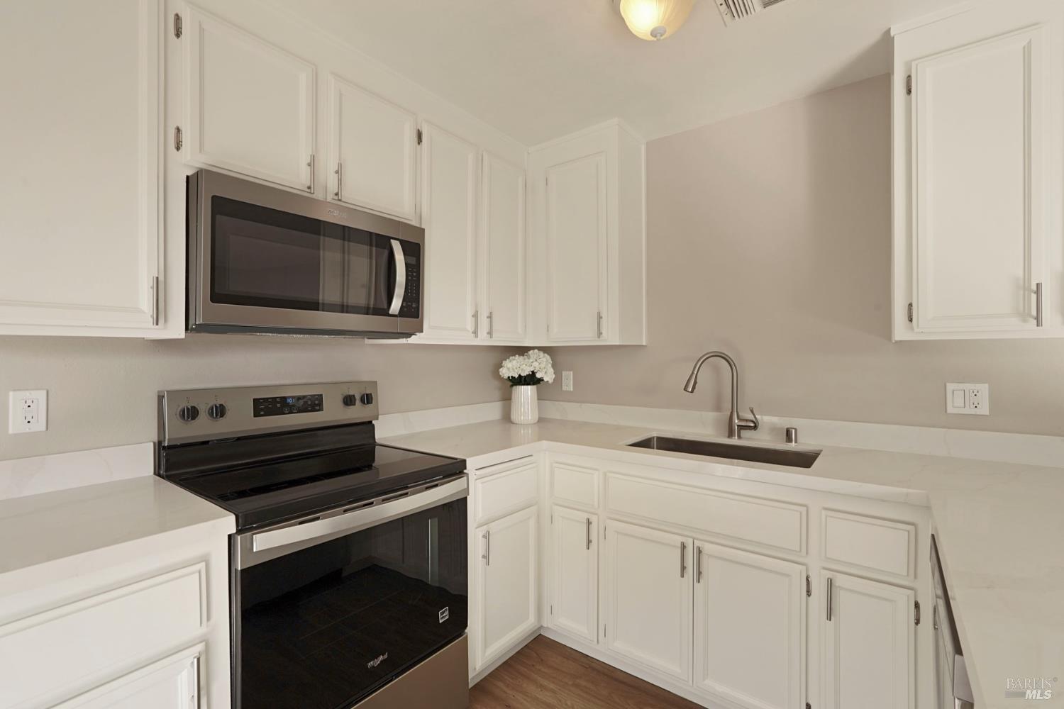 28 Amador Circle Rio Vista, CA 94571 - Photo 20 of 39 a kitchen with appliances a sink cabinets and a window