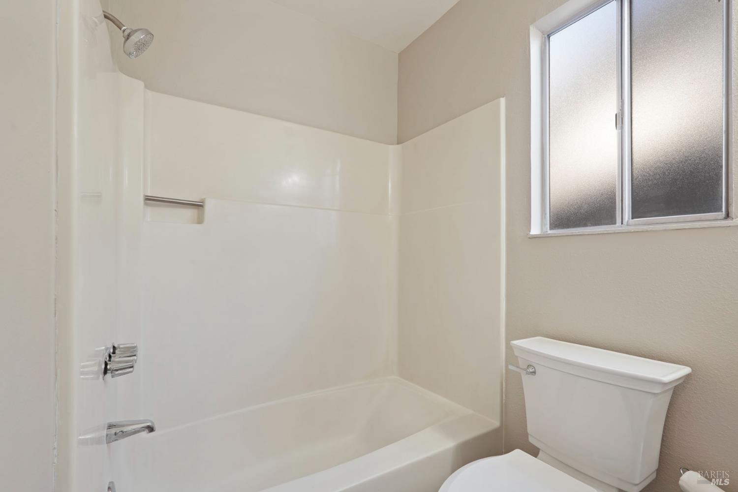 28 Amador Circle Rio Vista, CA 94571 - Photo 27 of 39 a bathroom with a toilet and a bathtub