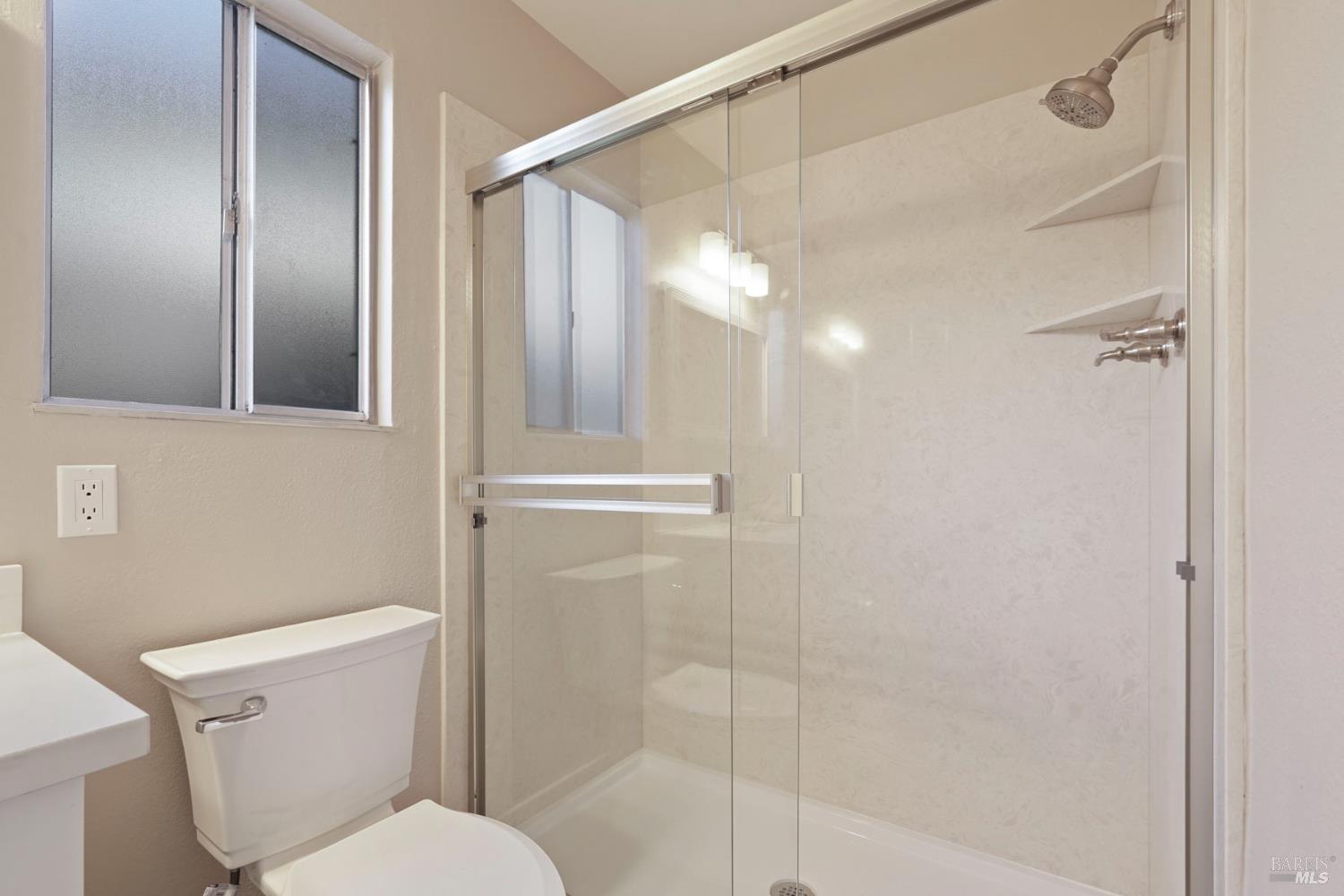 28 Amador Circle Rio Vista, CA 94571 - Photo 31 of 39 a bathroom with a shower a toilet and a sink