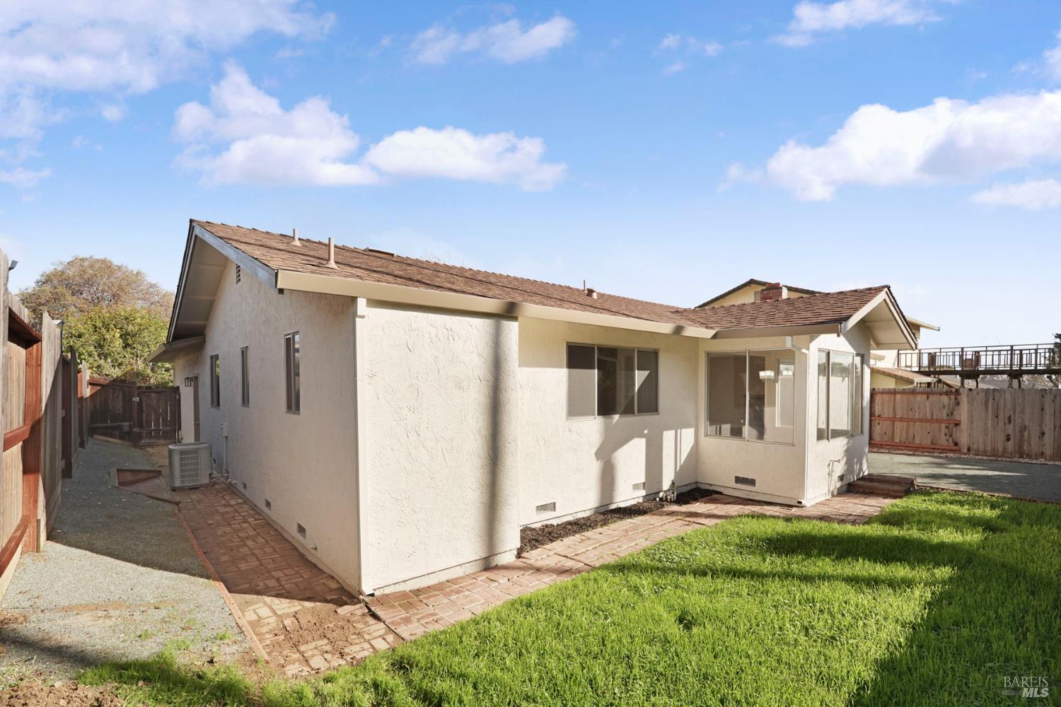 28 Amador Circle Rio Vista, CA 94571 - Photo 35 of 39 a view of a white house with a big yard and a yard