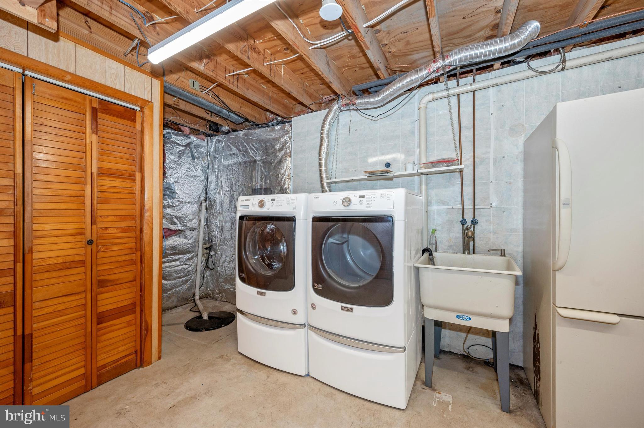 1025 Valen Road Westminster, MD 21157 - Photo 33 of 41 Laundry; safe in closet to the left; extra fridge