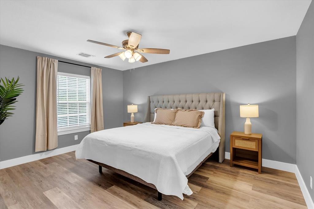 312 East Day Street Denison, TX 75021 - Photo 9 of 24 a bedroom with a bed and a window