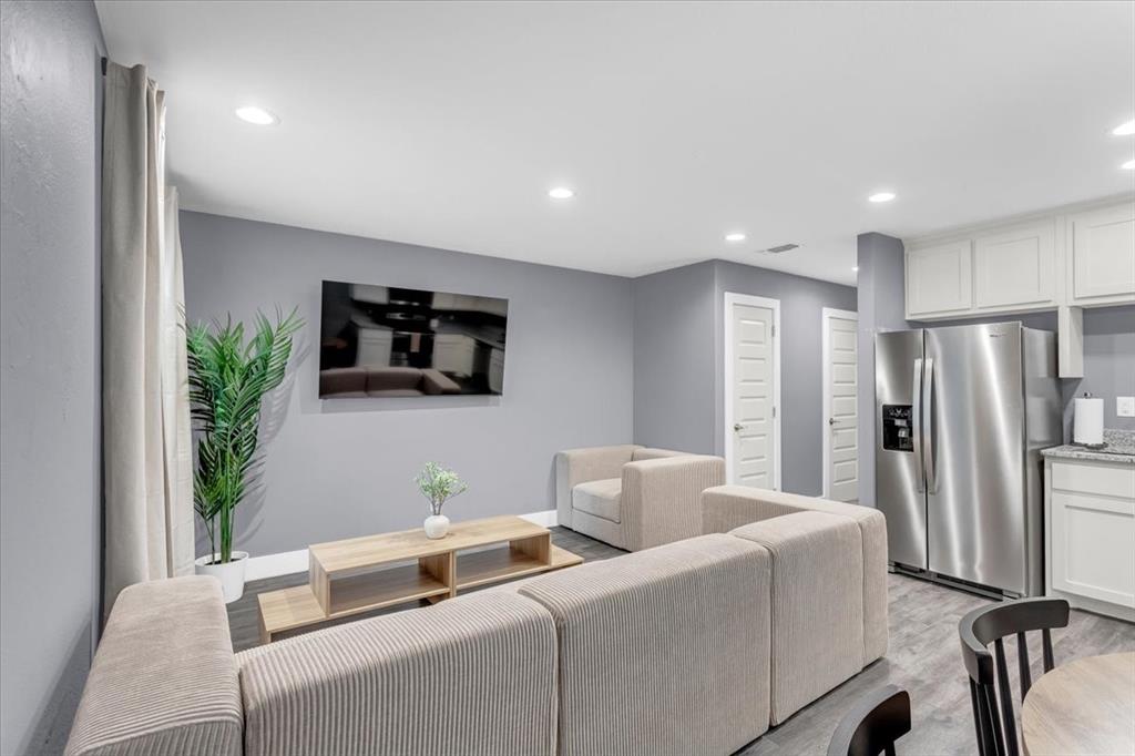 312 East Day Street Denison, TX 75021 - Photo 4 of 24 a living room with furniture and a flat screen tv