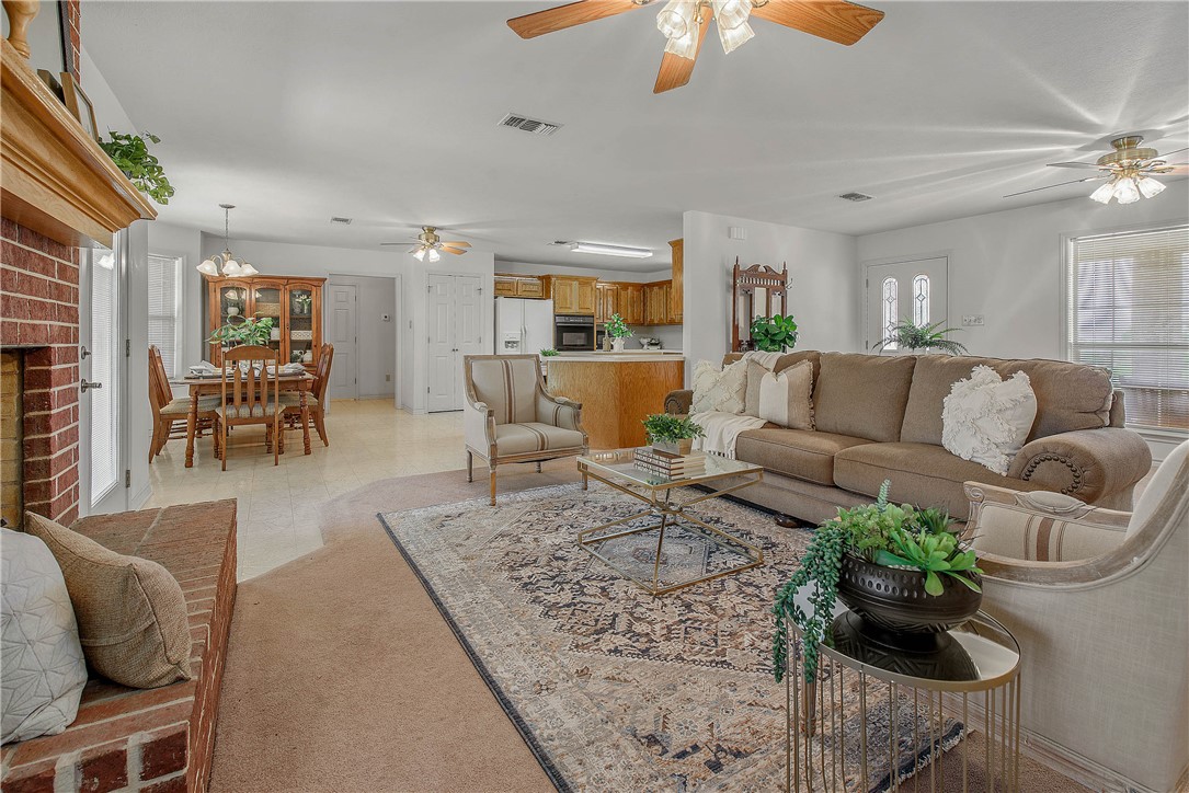 1110 County Road 439 Dime Box, TX 77853 - Photo 14 of 50 a living room with furniture wooden floor and chandelier