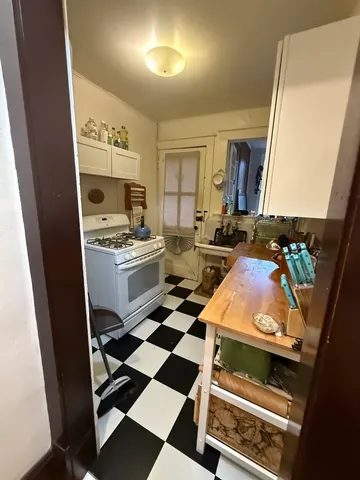 a kitchen with a stove and a refrigerator