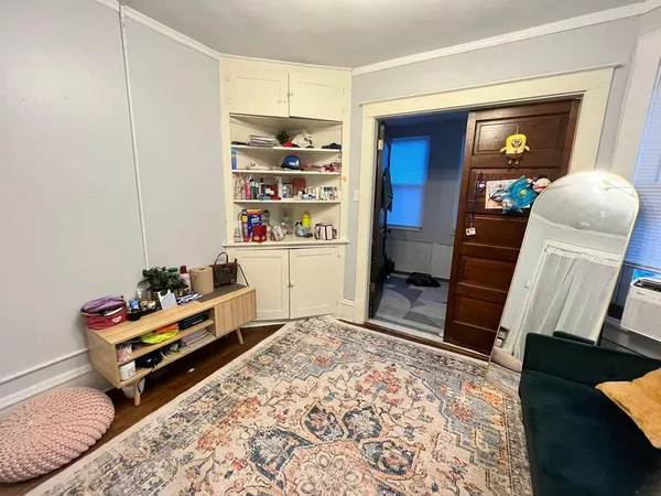a room with toys and dresser