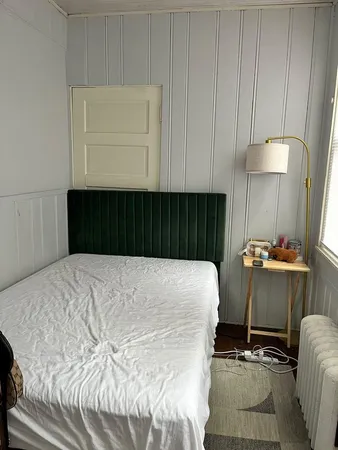 a bedroom with a bed and a cabinets