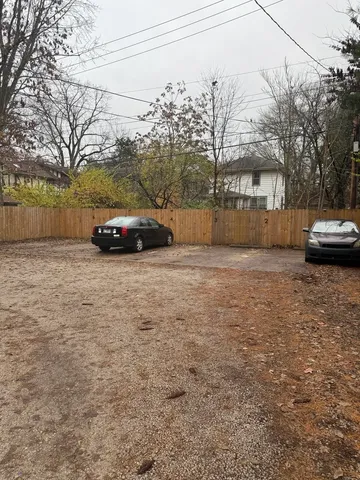 a view of street with parked cars