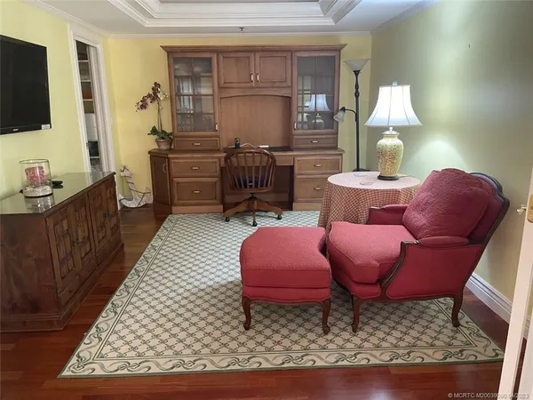 a bedroom with bed couch and window