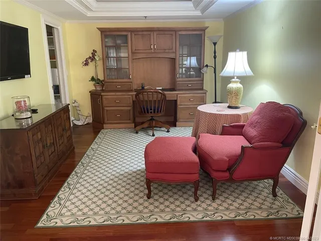 a bedroom with bed couch and window