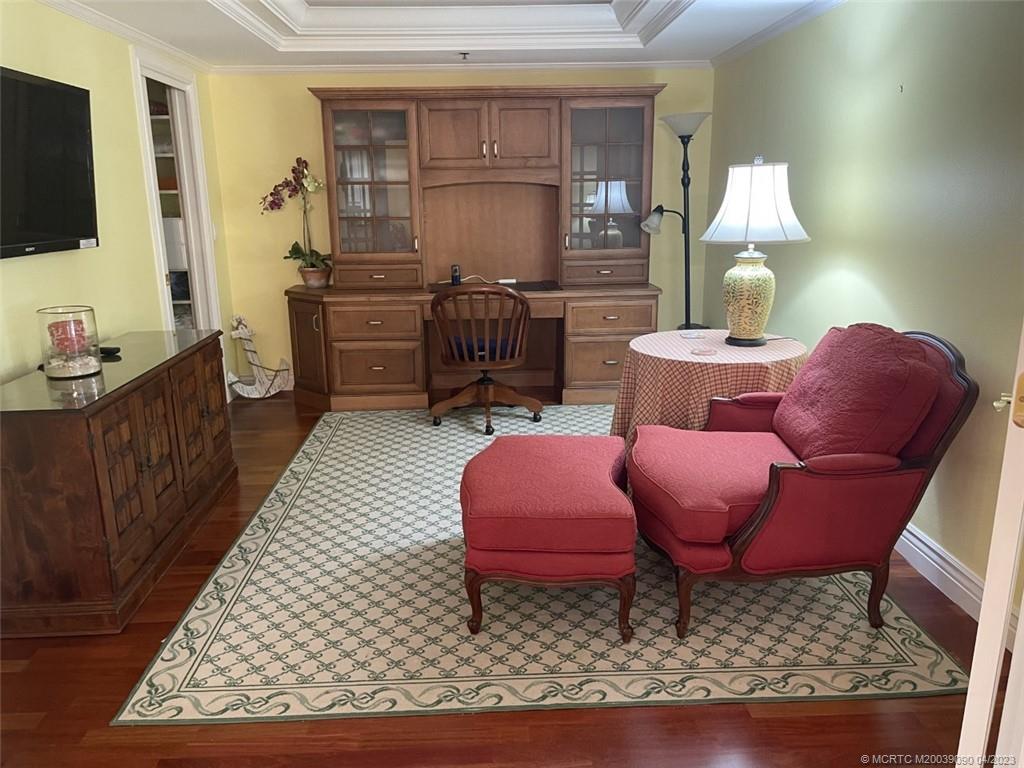 144 Northeast Edgewater Drive, Unit 3102 Stuart, FL 34996 - Photo 12 of 23 a living room with furniture a flat screen tv and rug