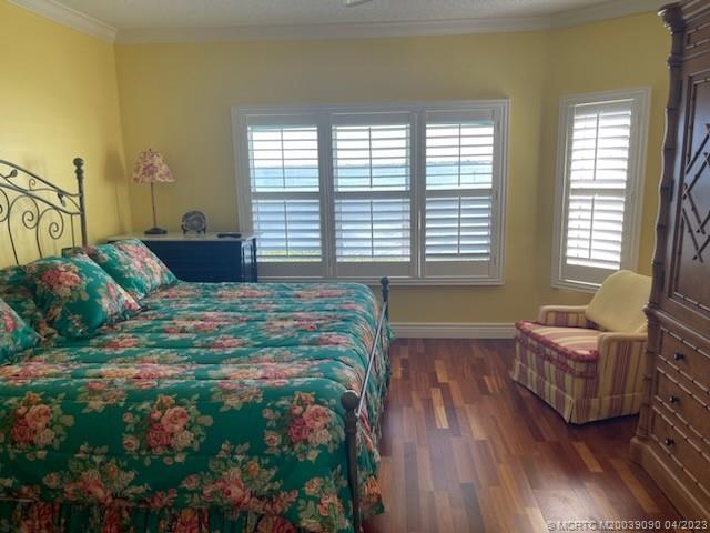 144 Northeast Edgewater Drive, Unit 3102 Stuart, FL 34996 - Photo 13 of 23 a bedroom with bed couch and window