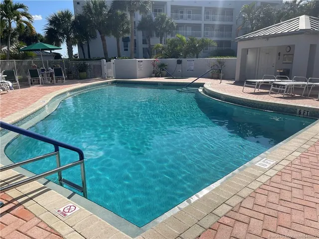 a view of a golf course with a lake